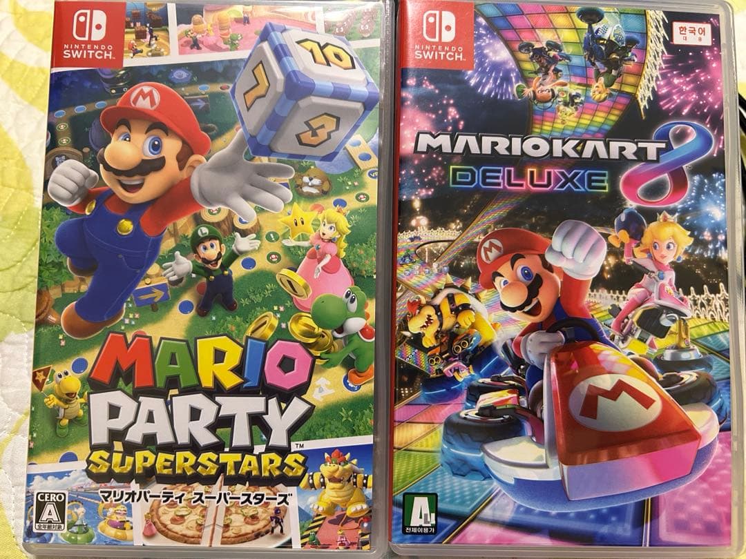 【値下げ】　Nintendo Switch + マリオソフト2本＋ハンドル2個付