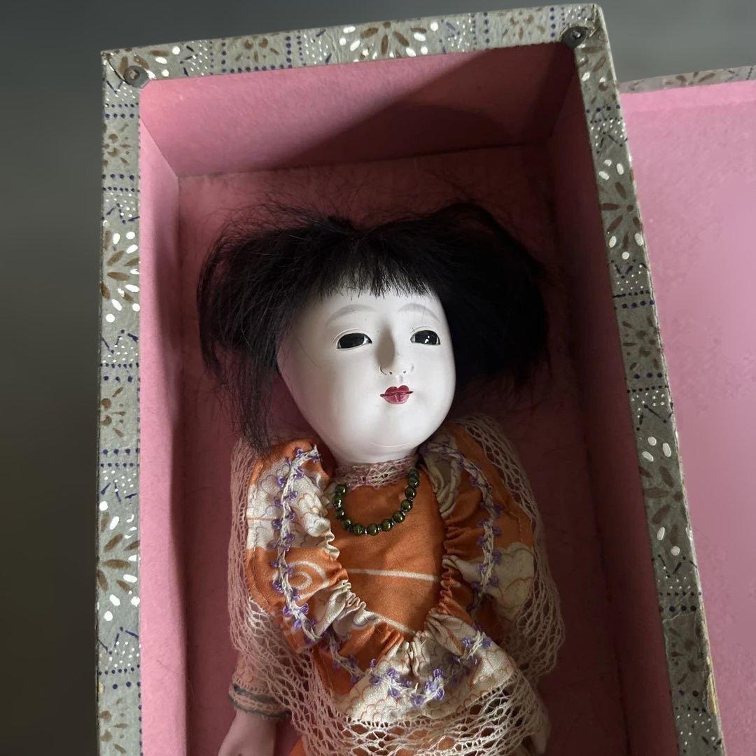 曰く付き…オレンジ色の和装ドレス日本人形
