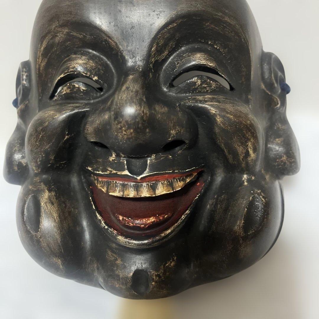 木製の笑顔の能面，大黒
