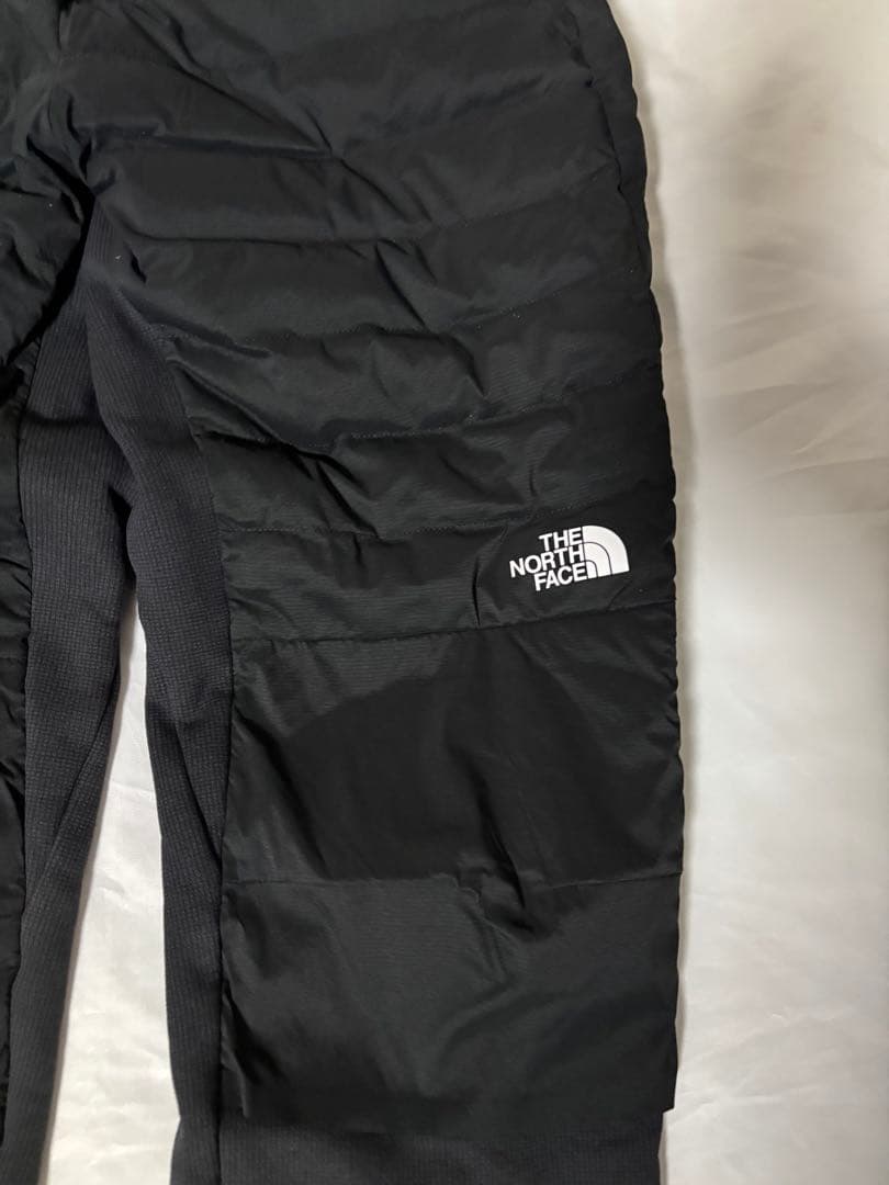 ザノースフェイス・ランニングダウンウェアNY82495レッドランロングパンツ黒Ｍ