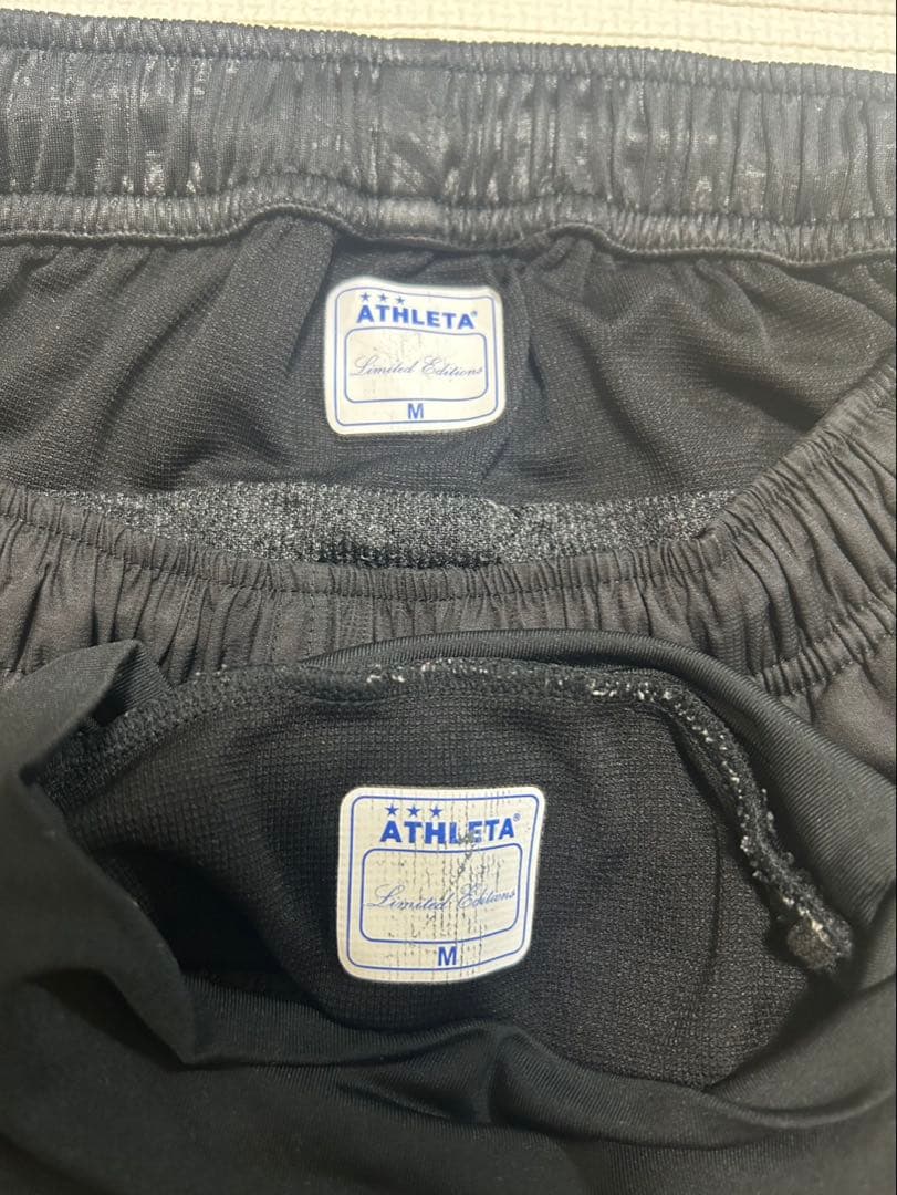 ATHLETA ピステ・ウィンドブレーカーセット ブラック　M