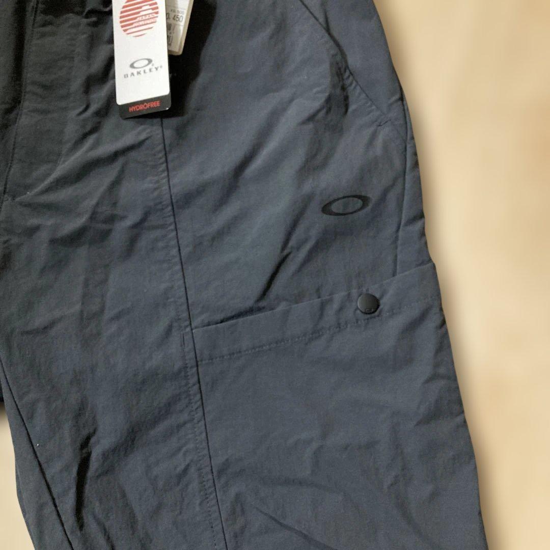 新品未使用タグ付きOAKLEYマットチャコールグレーピステウィンドブレーカーXL